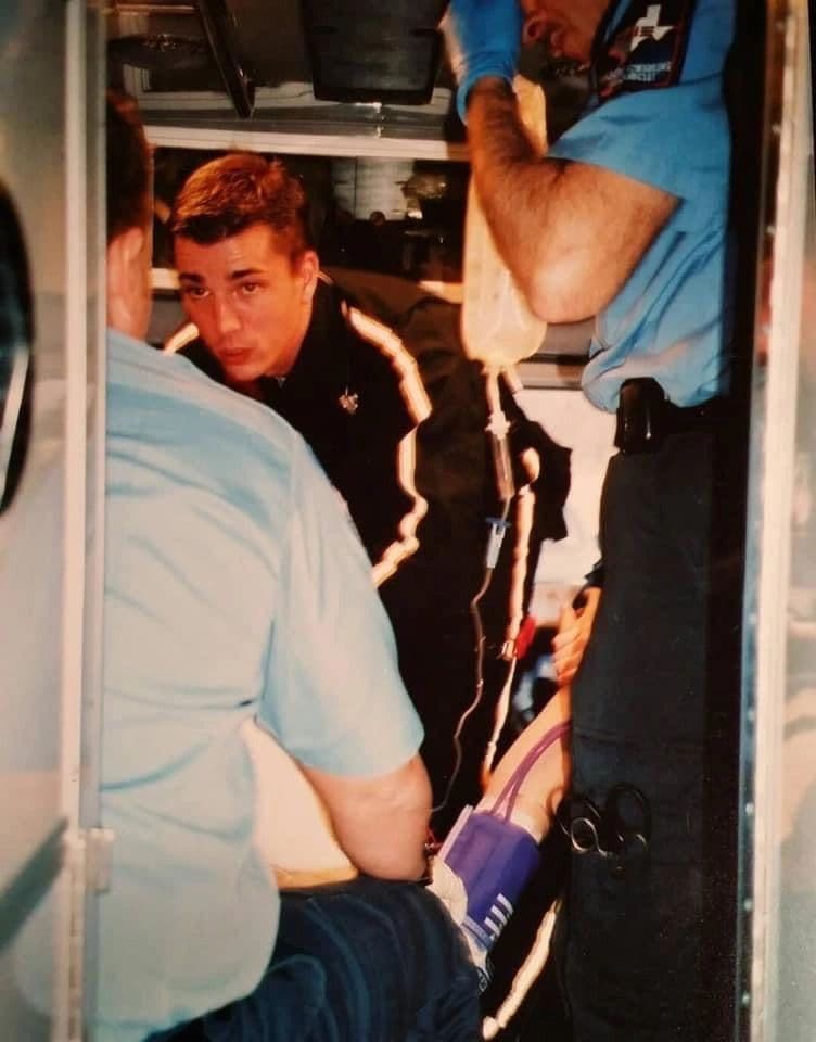 Aaron Kreag participating in patient care inside an ambulance